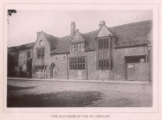 An early photograph of Grevel's House on Chipping Campden High Street: a tall stone house with a two-storey gabled bay window and an arched doorway, the print captioned in its day 'a fine old house of the 14th century'.