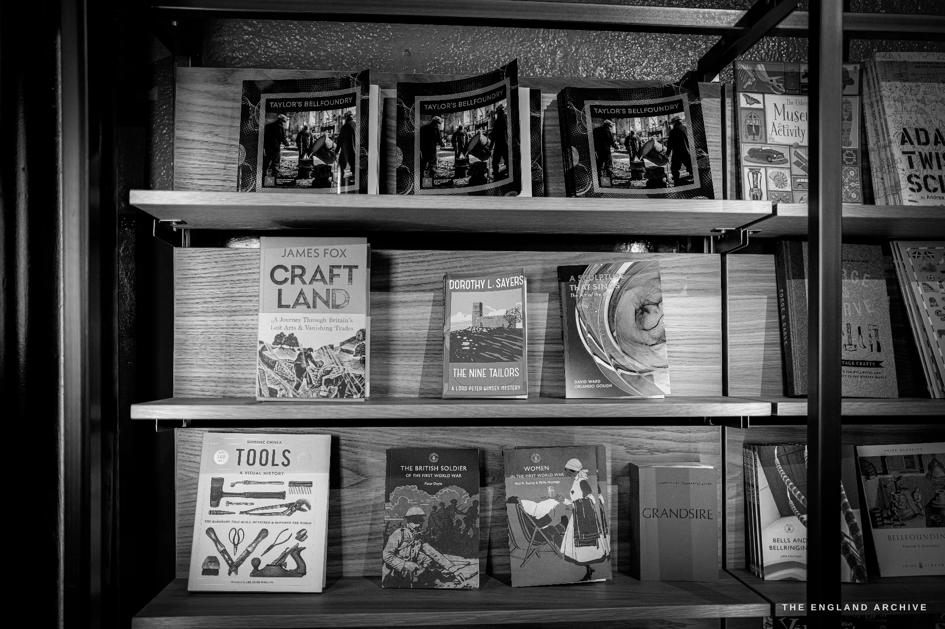The museum gift-shop bookshelves stocked with titles on bells, founding and ringing, and museum activity books.
