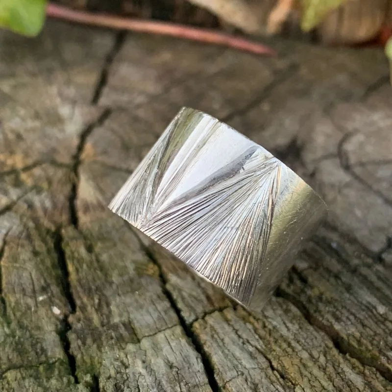 A hand-engraved silver ring.