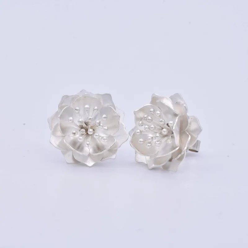 Peach Blossom earrings in silver.