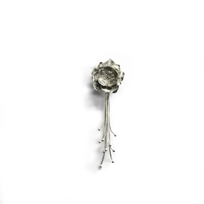 Handmade Sakura blossom brooch in silver.