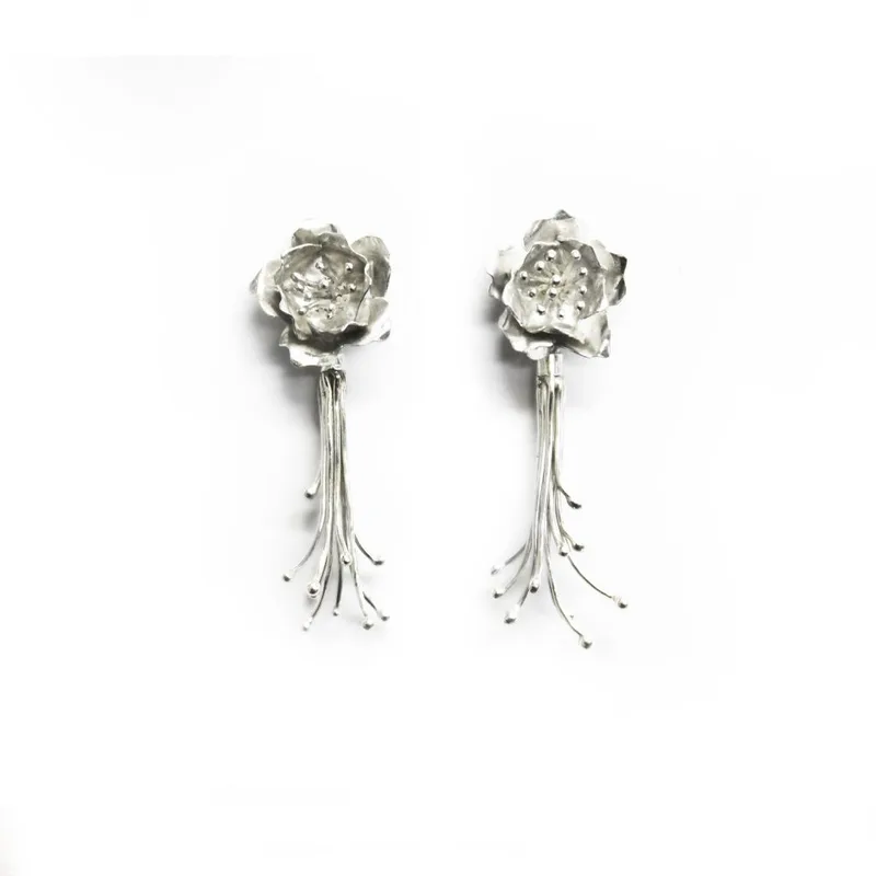 Handmade Sakura blossom earrings in silver with trailing stamens.