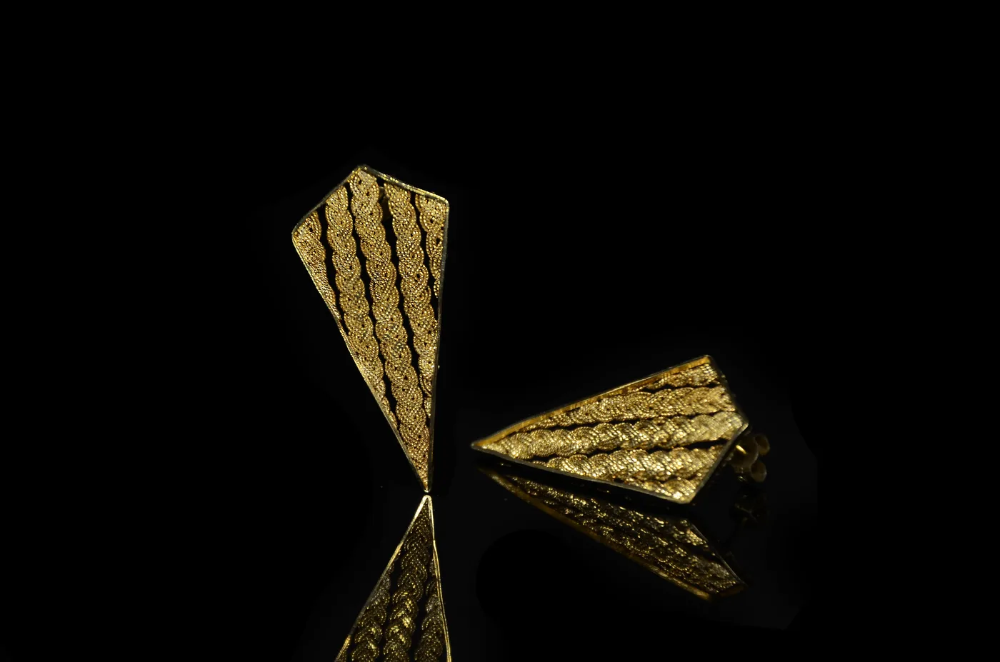 Filigree waving earrings finished in 24-carat gold plate.