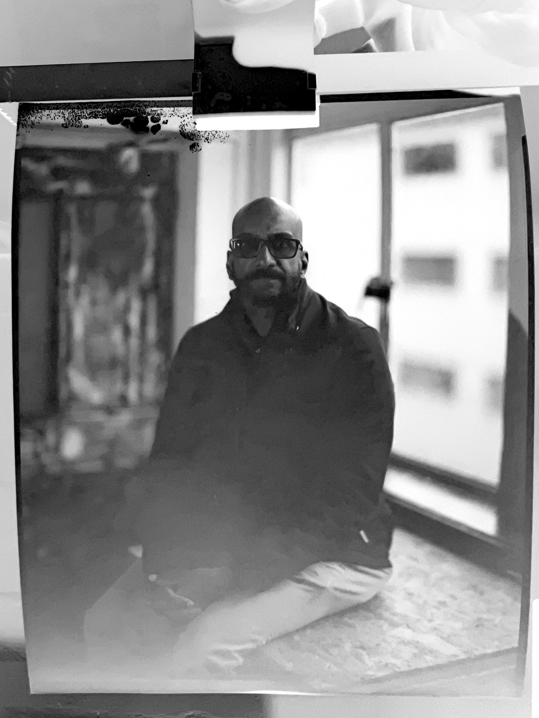 A single large format negative - the backlit portrait with tones inverted, showing the level of detail captured on sheet film