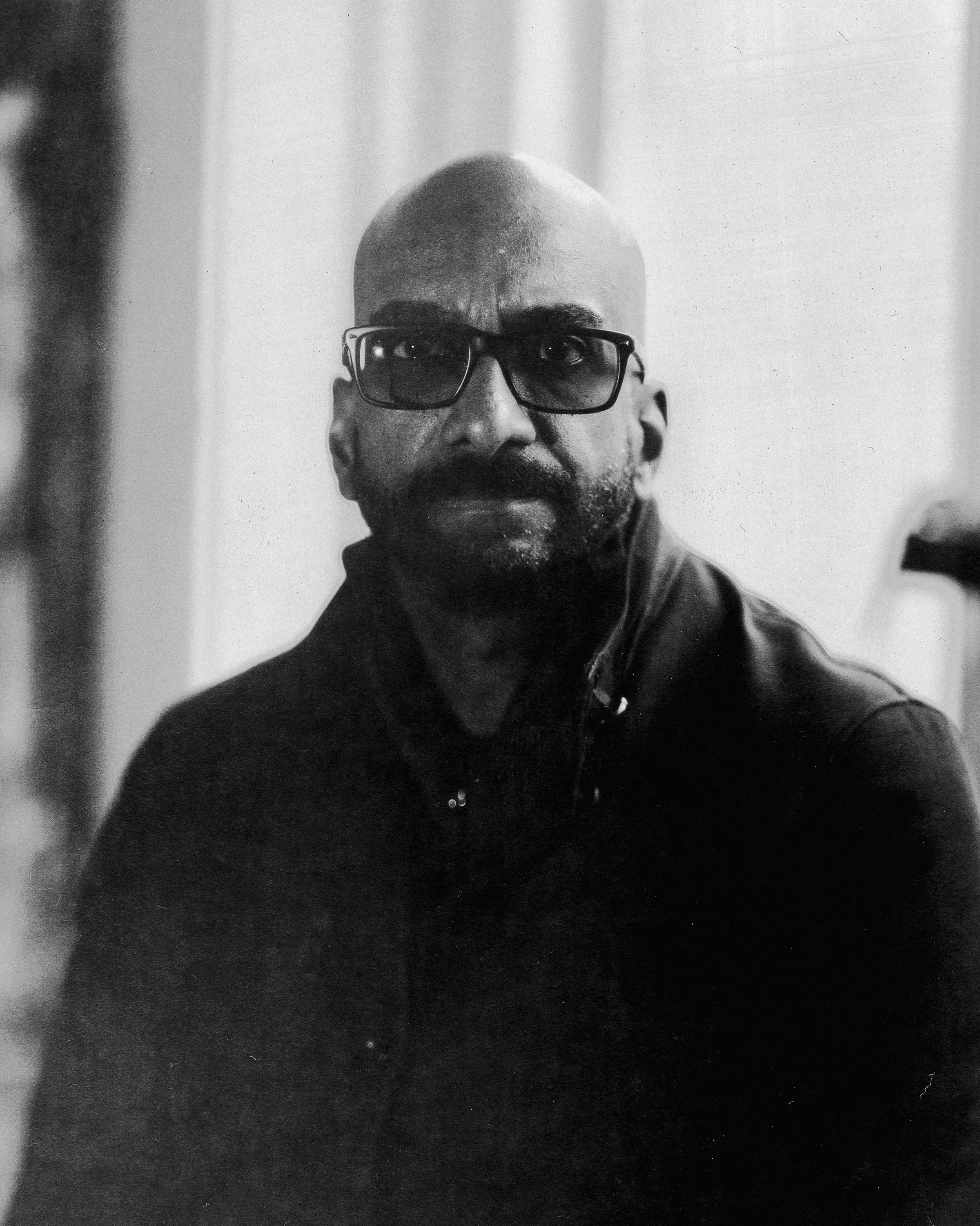 Large format black-and-white portrait - moody, dark tones, the kind of image that justifies the weight and cost of the 4x5